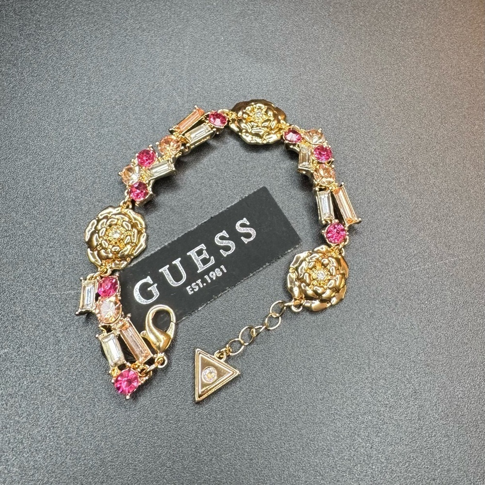 Beautiful Guess Crystal and  Flower Necklace in Goldtone